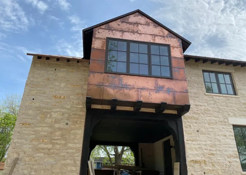Copper metal panel facade on a stone building for Roof Repair in San Luis Obispo